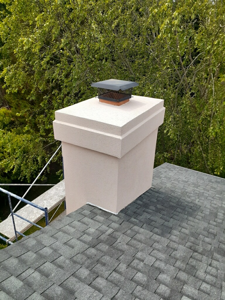 Finished EIFS chimney chase with matched stucco finish